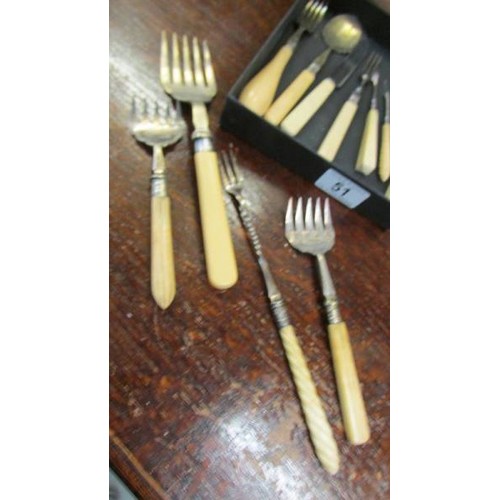 51 - A mixed lot of bone handled cutlery.