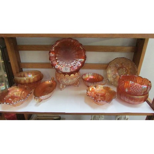 77 - A quantity of marigold carnival glass dishes, COLLECT ONLY.