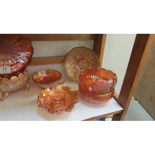 77 - A quantity of marigold carnival glass dishes, COLLECT ONLY.