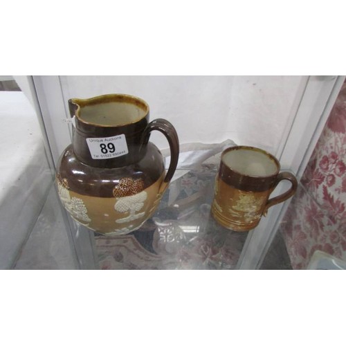 89 - A Doulton stoneware Harvest jug and mug.