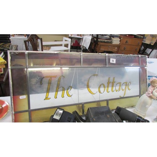 94 - A leaded glass 'The Cottage' sign. COLLECT ONLY.