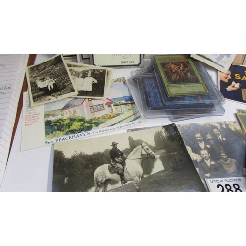 288 - A mixed lot of postcards, photographs, collector's cards etc.,