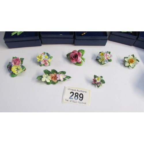 289 - A quantity of porcelain flower brooches.