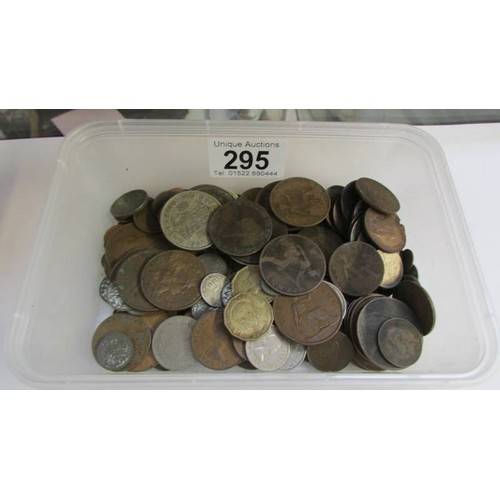 295 - A mixed lot of coins, bank notes, two cash tins etc.,