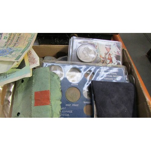 295 - A mixed lot of coins, bank notes, two cash tins etc.,