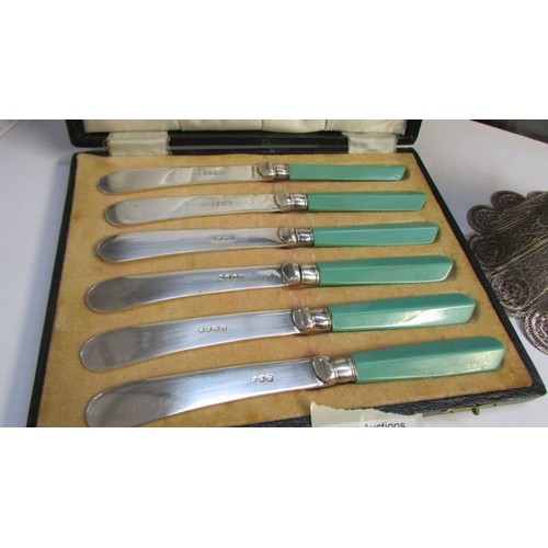 296 - A cased set of butter knives and a filigree sweetmeat dish.