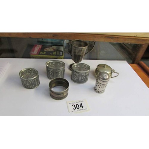 304 - A mixed lot including napkin rings.