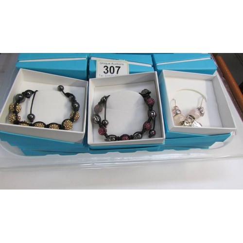 307 - 17 boxed 'Little Angels' bracelets.