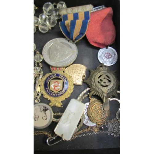 315 - A mixed lot of medals, badges etc.,