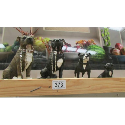 373 - Four pit bull terrier figures.