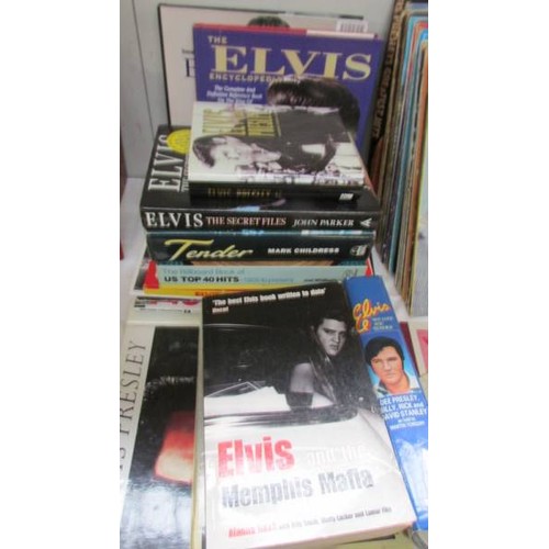 389 - A quantity of Elvis Lp's, singles, books etc.,