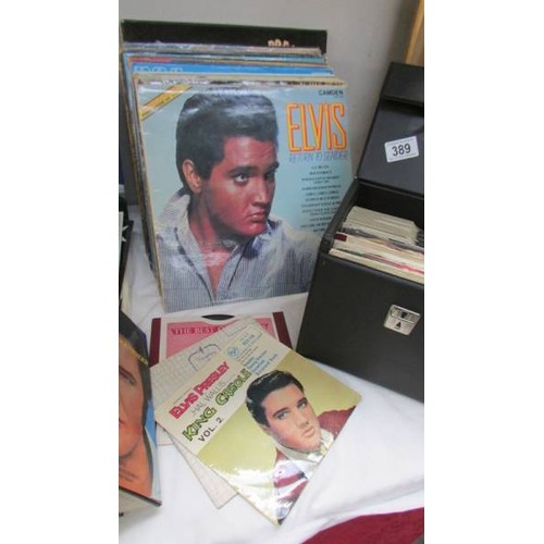 389 - A quantity of Elvis Lp's, singles, books etc.,