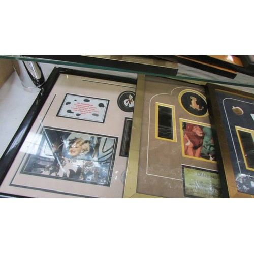 399 - A quantity of framed & glazed limited edition Disney film cerlls, badges etc., COLLECT ONLY.