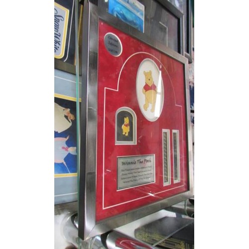 399 - A quantity of framed & glazed limited edition Disney film cerlls, badges etc., COLLECT ONLY.