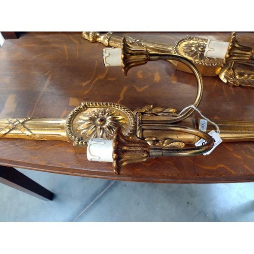 523 - A pair of gilded ormalu style wall lights (length 67cm) (plastic) COLLECT ONLY