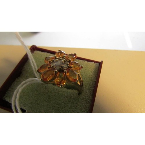 2005 - A yellow gold natural yellow sapphire and diamond ring, size R, 5 grams.