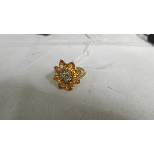 2005 - A yellow gold natural yellow sapphire and diamond ring, size R, 5 grams.