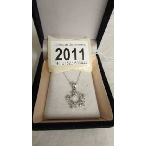 2011 - A 18ct white gold pendant on 18ct gold chain, 3 grams.