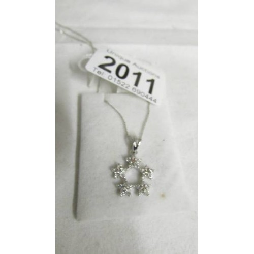 2011 - A 18ct white gold pendant on 18ct gold chain, 3 grams.