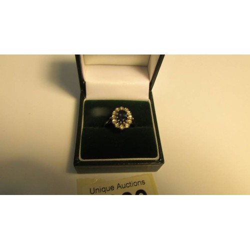 2022 - An 18ct gold sapphire and diamond ring, size N, 3.9 grams.