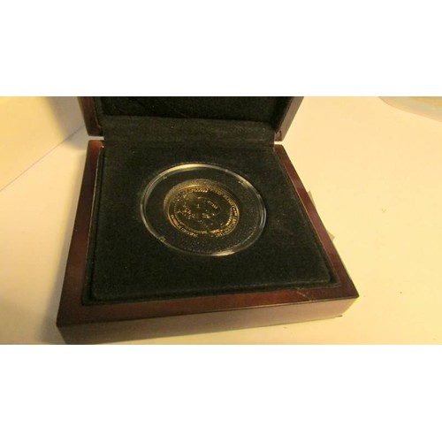 2101 - An Avro Lancaster 75th Anniversary commemorative double crown in 9ct gold, 28mm diameter, 4 grams.