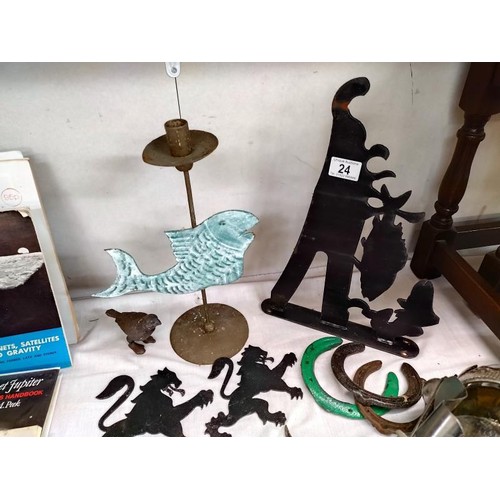 24 - A quantity of metal ware including novelty dog bottle holder, rampant lions & a fish wall bracket