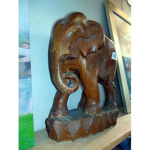 1027 - A carved wood elephant. COLLECT ONLY.