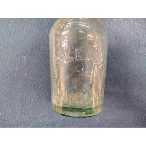 1050 - A quantity of vintage bottles including stoneware Lincoln ginger beer bottles. COLLECT ONLY.