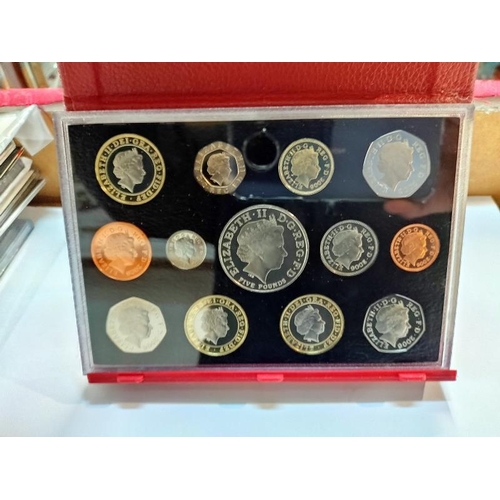 2116 - A selection of UK coin sets including Queen Mother Memorial Crown etc.