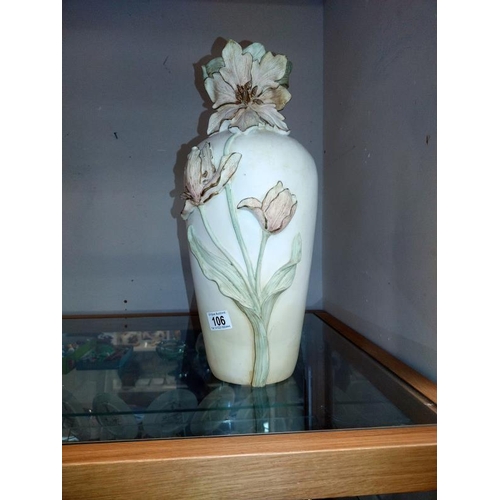 106 - A tall ornate vase with relief flower decoration, height 45cm, COLLECT ONLY.