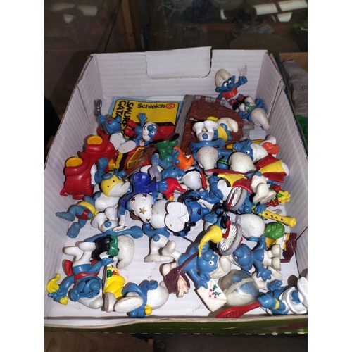 109 - A good selection of vintage Smurfs with extra and catalogue