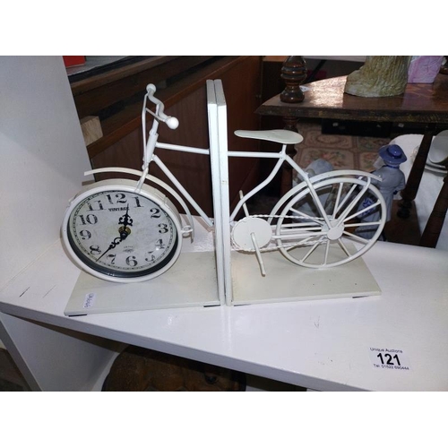 121 - Vintage style bicycle clock bookends and a brass framed London quartz clock