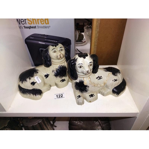 122 - A pair of reclining Staffordshire dogs