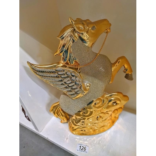 126 - A large ornate gilded pottery winged rearing horse height 36cm, COLLECT ONLY.