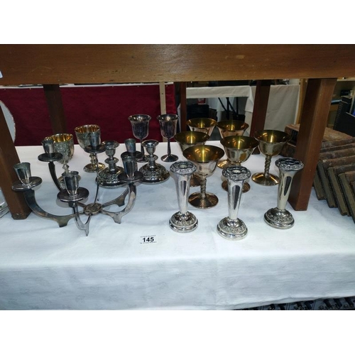 145 - A quantity of silver plate including art deco candleabra etc