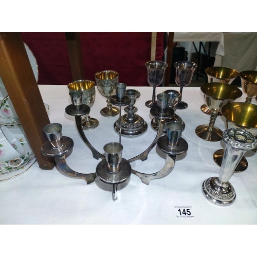 145 - A quantity of silver plate including art deco candleabra etc