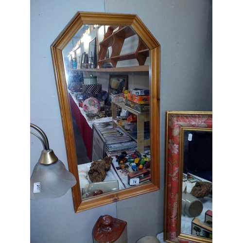 74 - A pine framed mirror 35cm x 65cm, COLLECT ONLY.