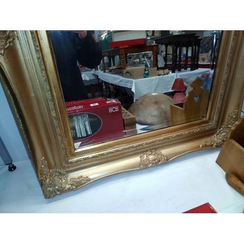 85 - An antique gilt framed bevel edged mirror (chip to frame) 74cm x 94cm, COLLECT ONLY.