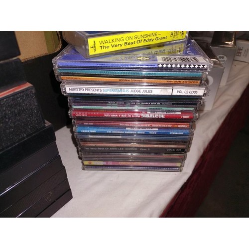 59 - A good lot of 45's single records, cd's and cassette tapes