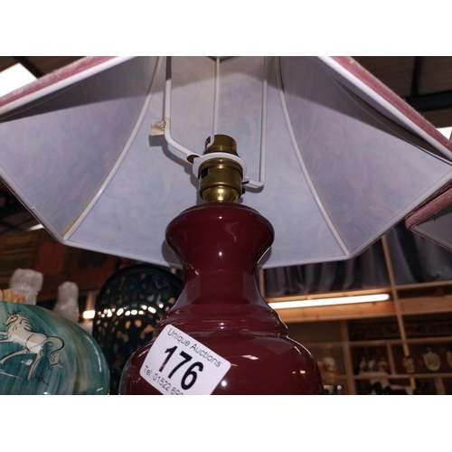 176 - A pair of red pottery table lamps with shades, COLLECT ONLY.