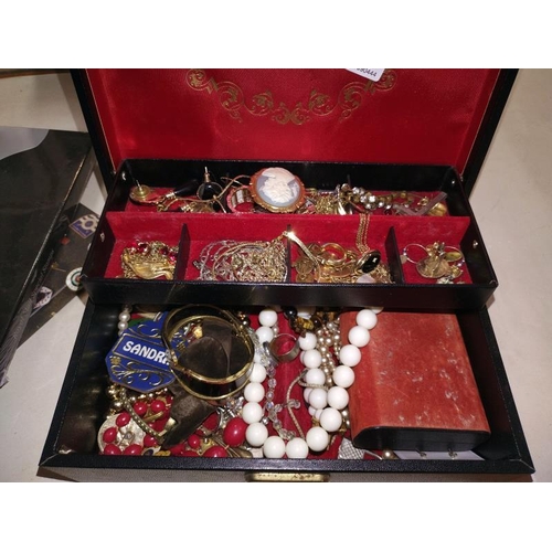 228 - A jewellery box and contents