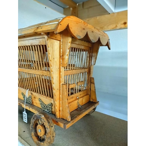 2191 - A vintage Gypsy caravan shaped wooden bird cage. 43cm x 28cm x Height 37cm. COLLECT ONLY.