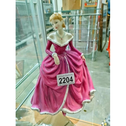 2204 - A Royal Doulton figure 'Belle' HN4235