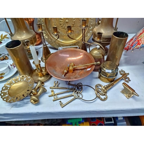 1057 - A selection of brassware including shell cases, carriage hub nut, etc  COLLECT ONLY.