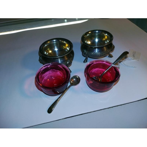 2095 - A pair of silver plate salts with Cranberry glass liners and two silver salt spoons