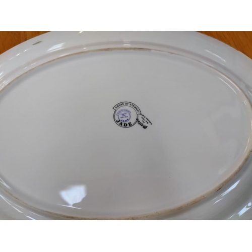 1091 - An oval platter decorated with pike by House of Stewart, 40 cm x 31 cm.  COLLECT ONLY.