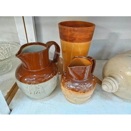 1094 - Four stoneware jugs including Doulton Lambeth, foot warmer and vase.  COLLECT ONLY.