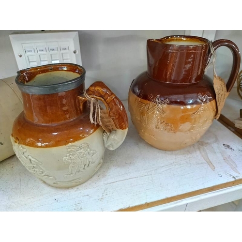 1094 - Four stoneware jugs including Doulton Lambeth, foot warmer and vase.  COLLECT ONLY.