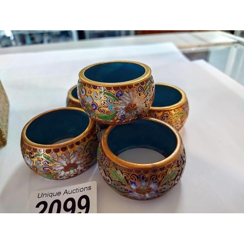 2099 - A Chinese reverse painting on glass ornament on stand and a set of five Cloisonne enamel napkin ring... 