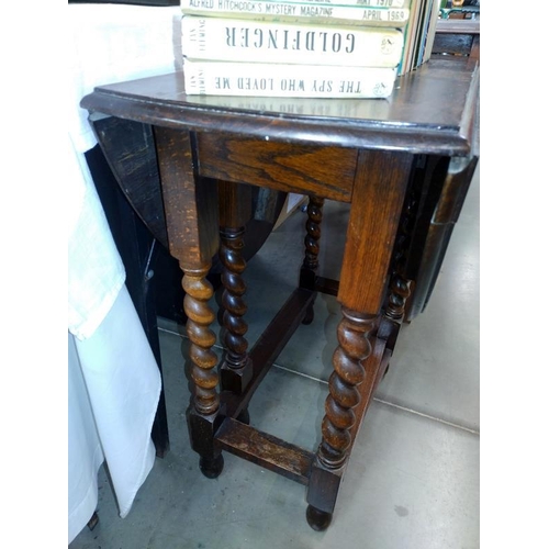 237 - A dark oak gateleg table with barley twist legs. 71cm x 37cm x Height 72cm.  COLLECT ONLY.